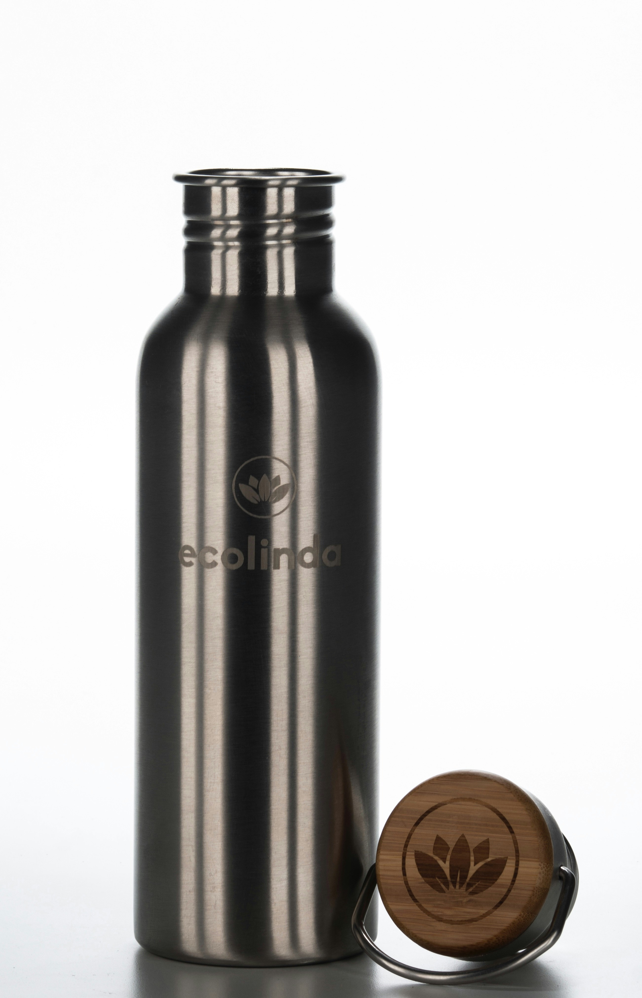 Brushed steel water bottle with engraved logo on white background