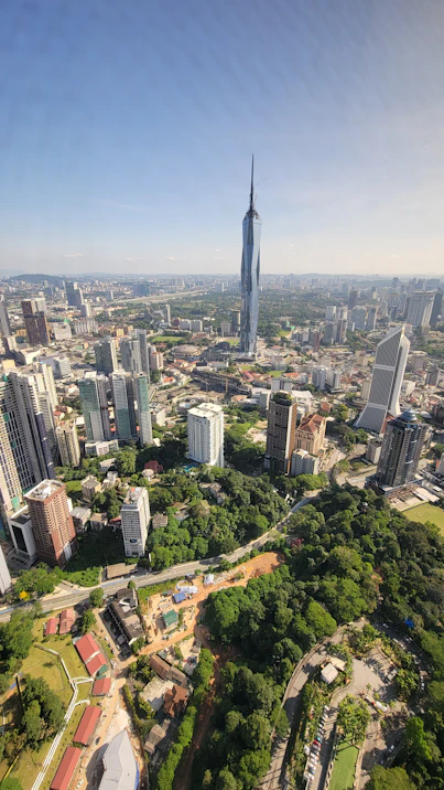 an aerial view of a city with tall buildings