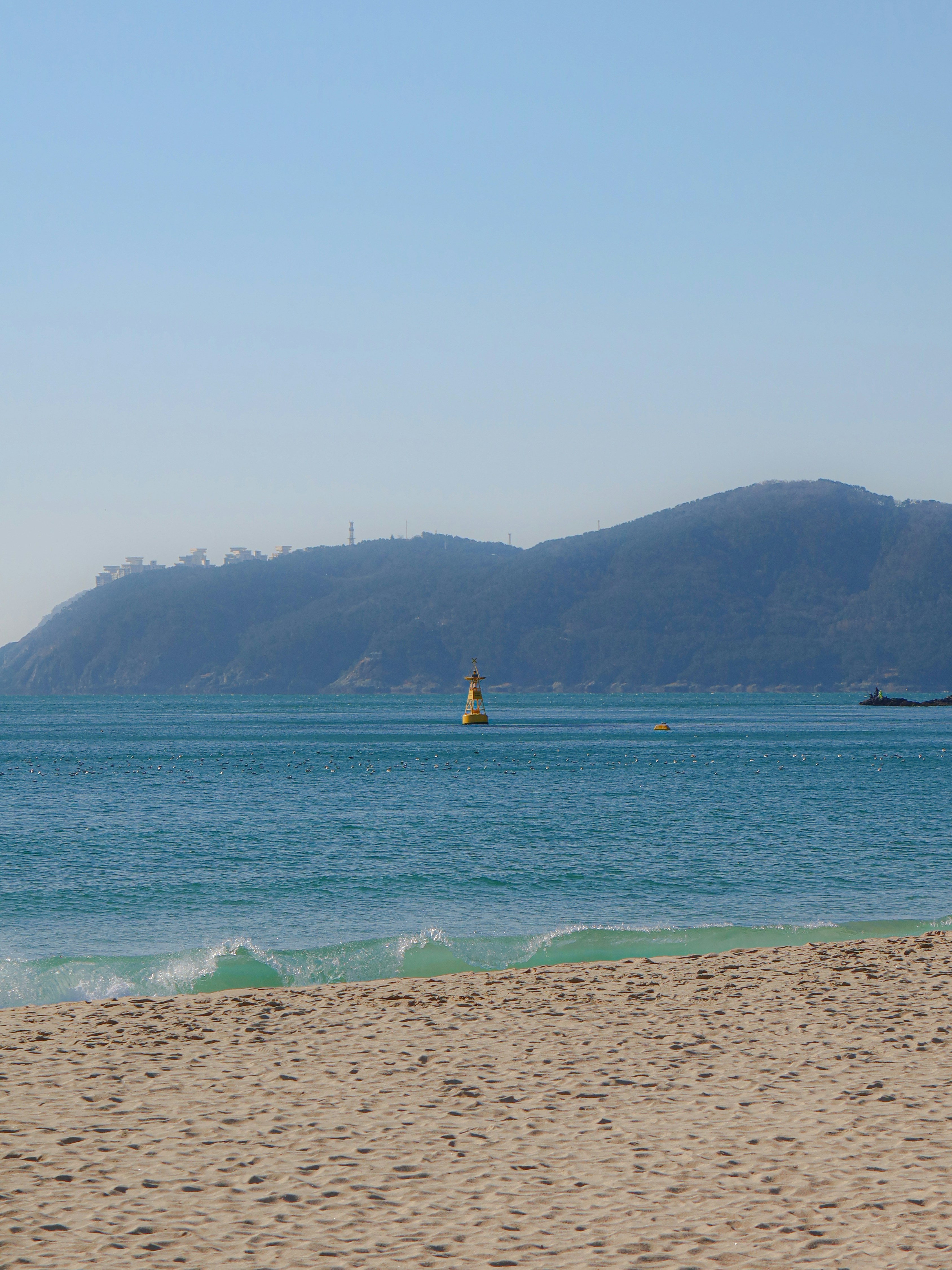 a person riding a surf board on a body of water