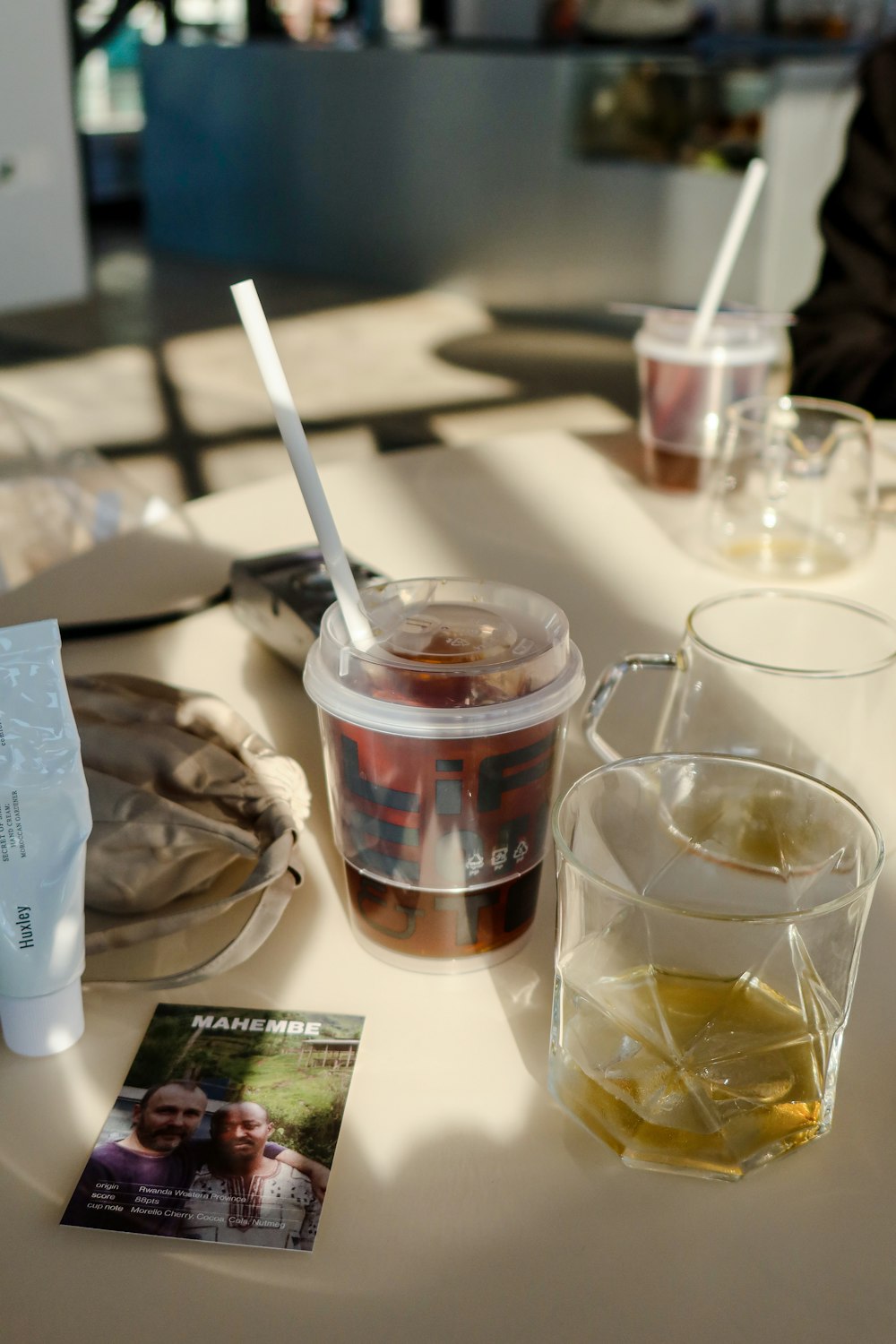 a table topped with drinks and a magazine