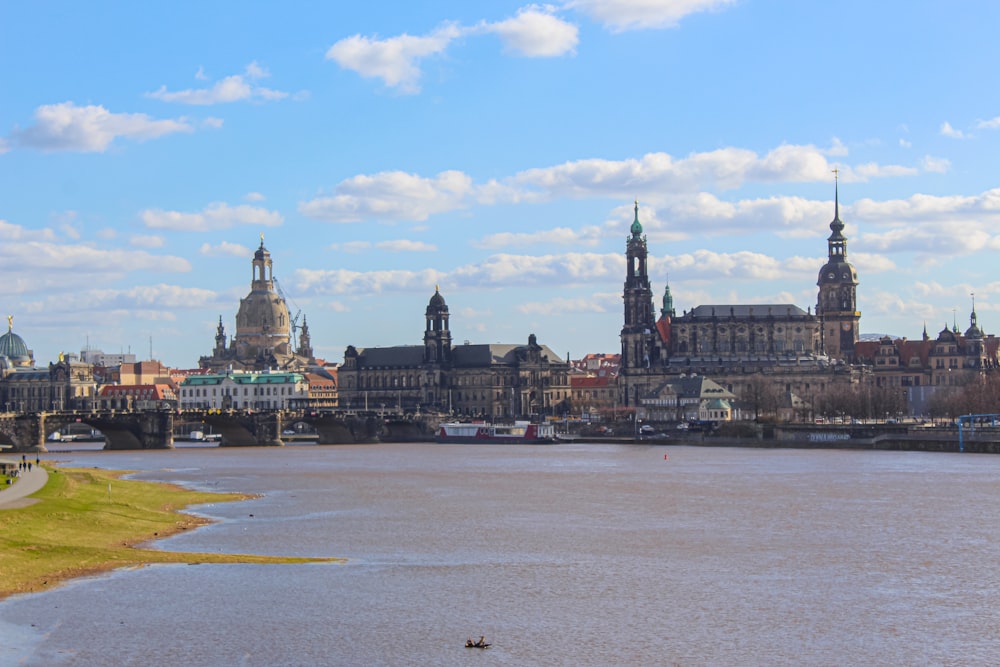 a large body of water with a city in the background