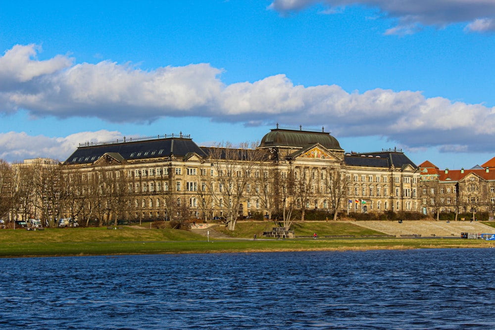 a large building next to a body of water