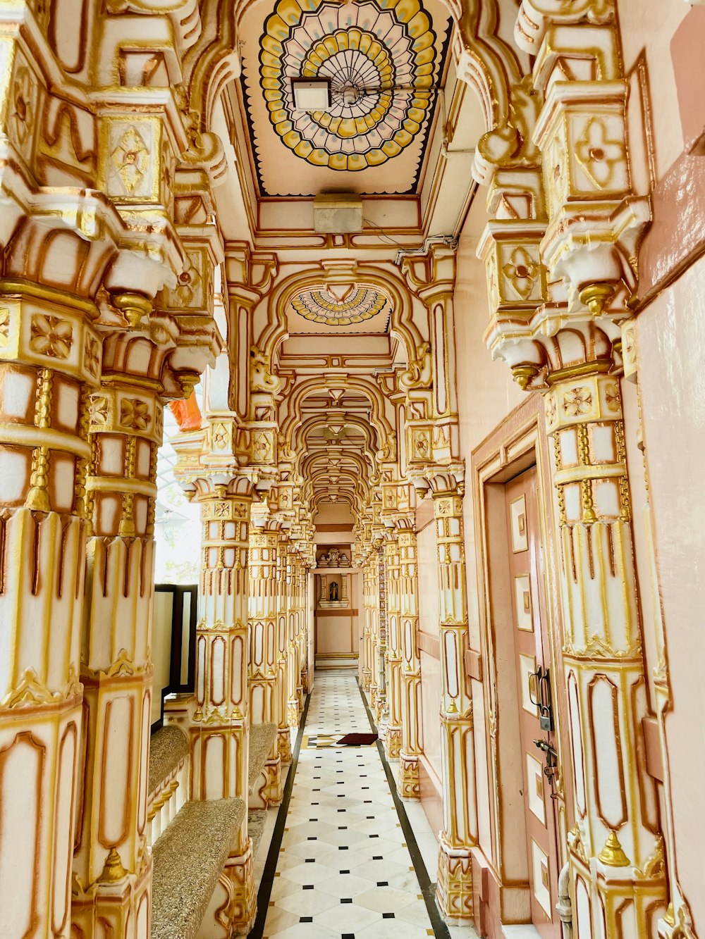 a long hallway with a clock on the ceiling