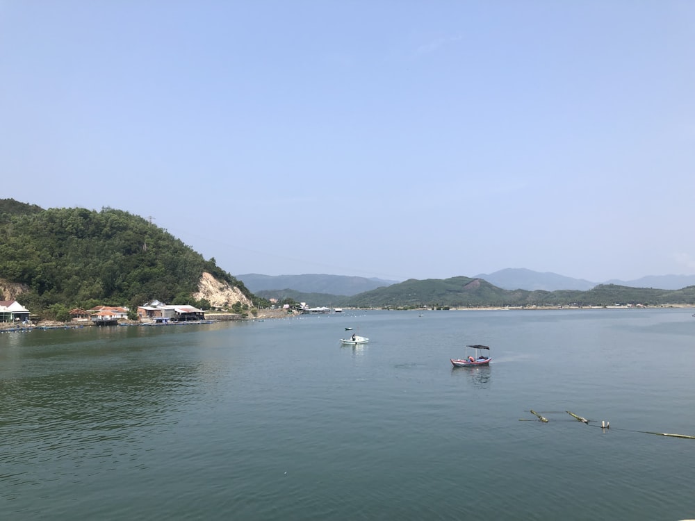 a body of water with boats floating on it