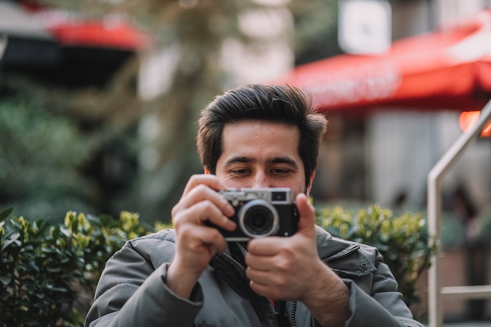 a man taking a picture of himself with a camera