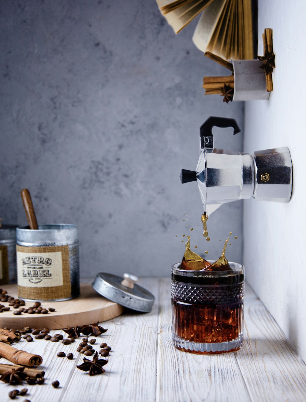 a coffee grinder pouring coffee into a jar
