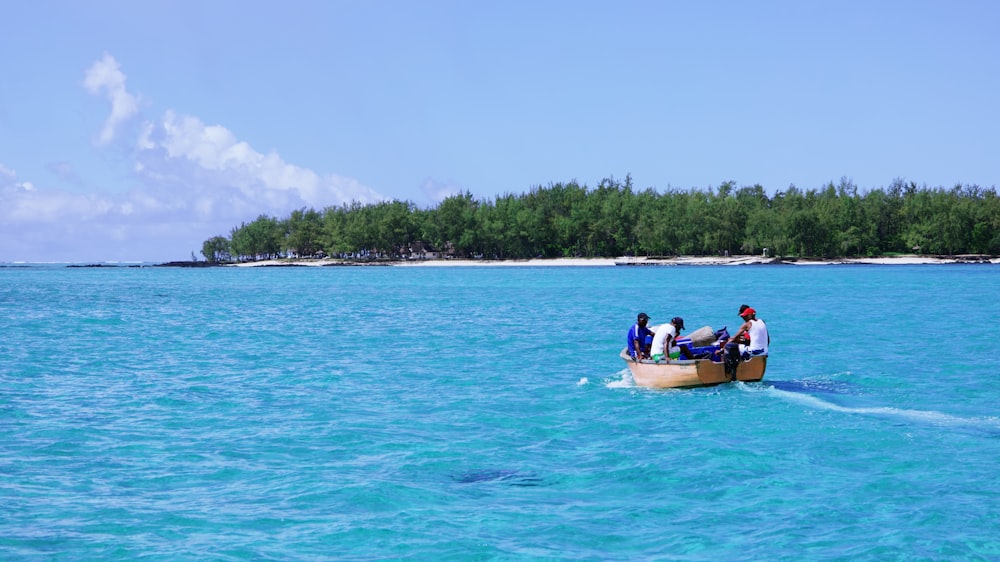 a group of people on a boat in the ocean