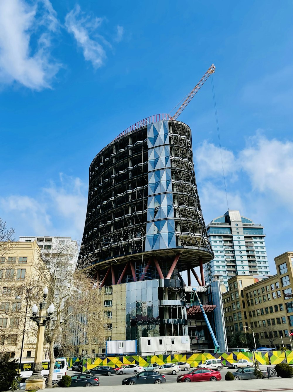 a very tall building with a crane on top of it