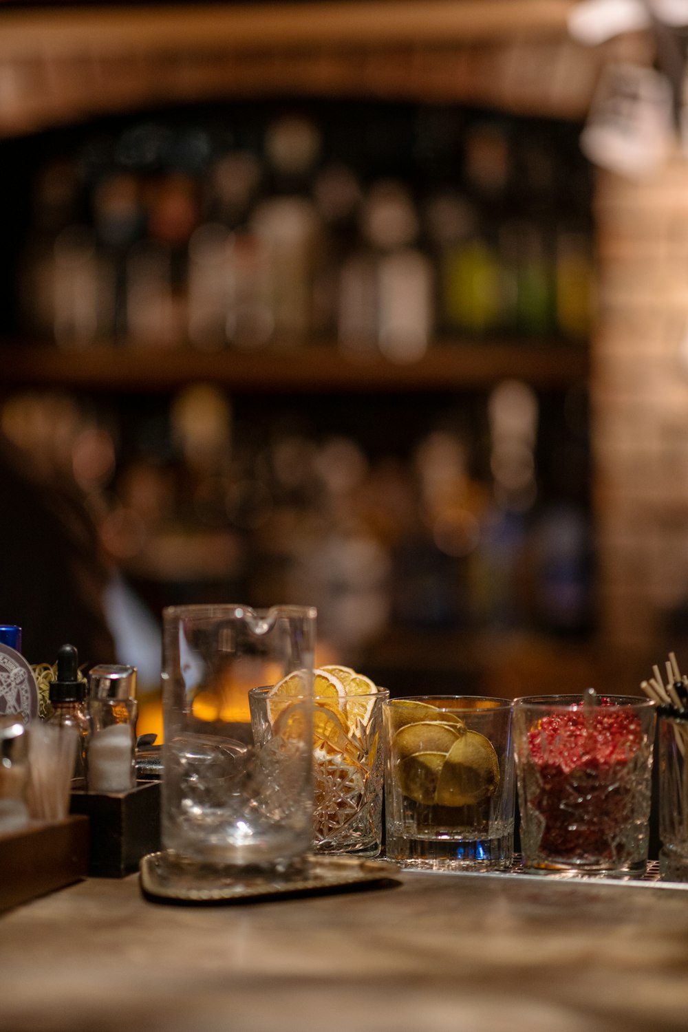 a row of glasses sitting on top of a wooden table