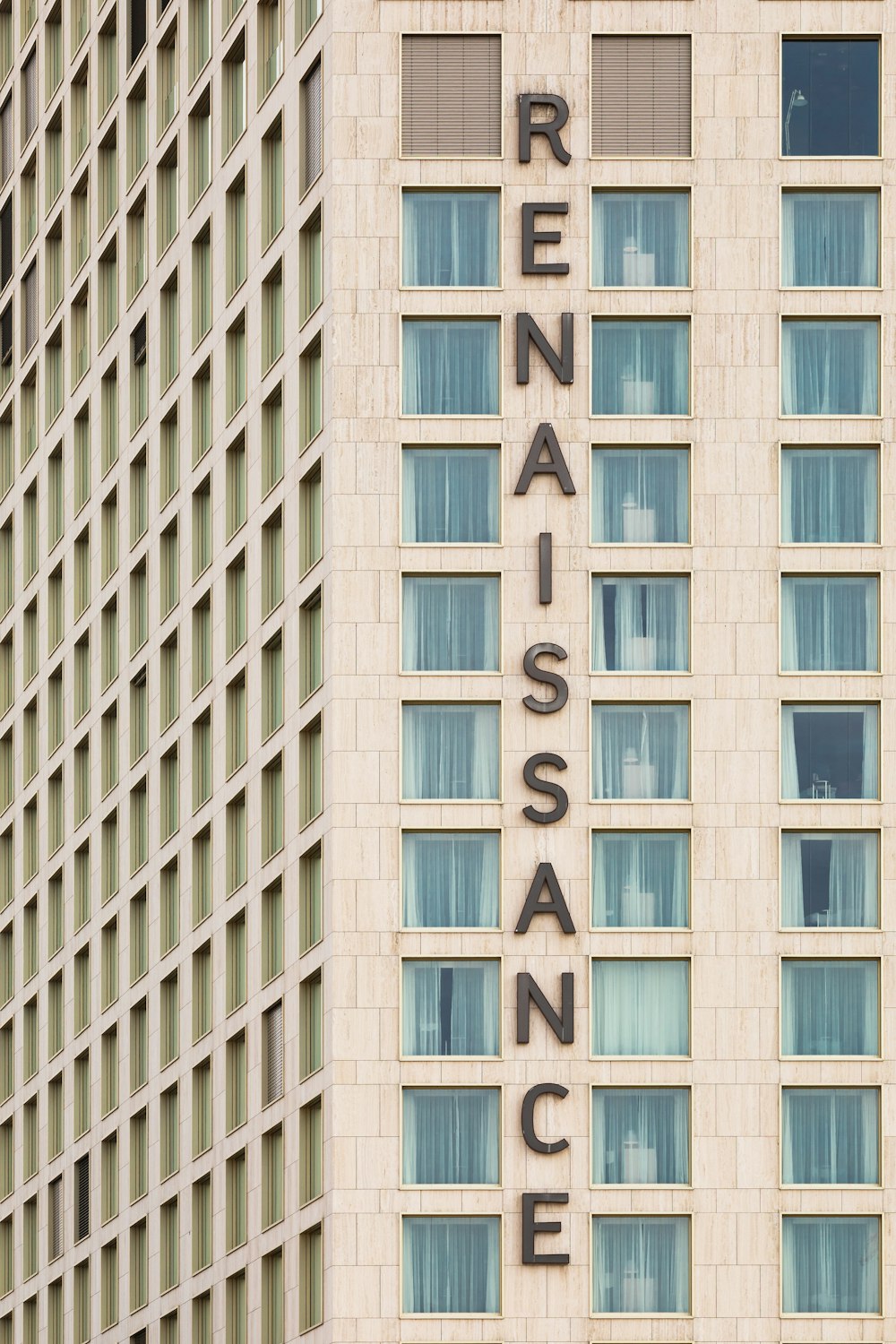 a tall building with a sign on the side of it