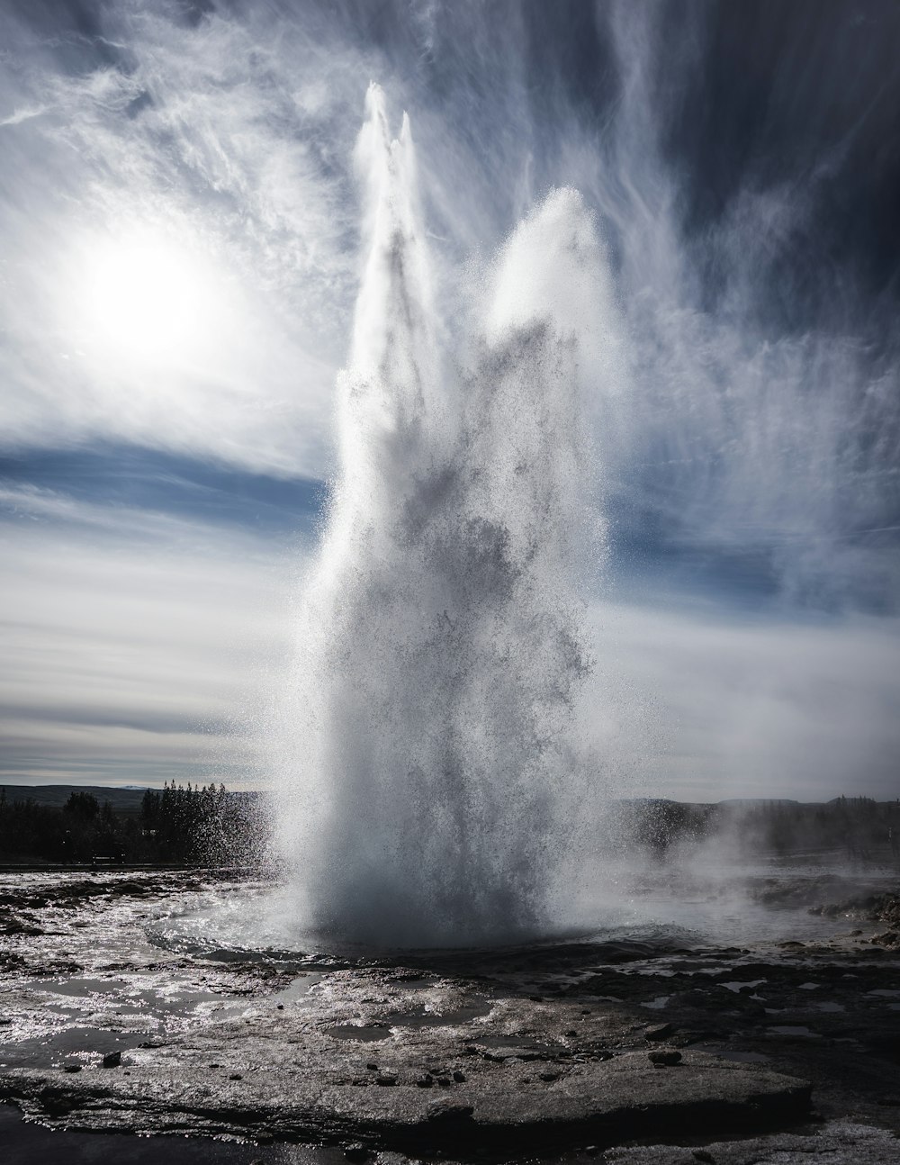 a body of water with smoke coming out of it