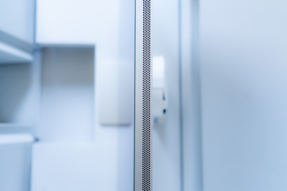 a close up of a bathroom door with a light on