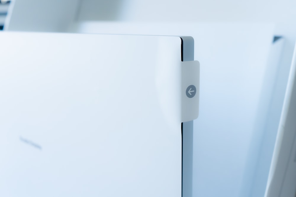 a close up of a white refrigerator door