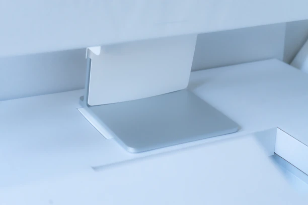 A minimalist professional desk setup featuring vibrant blue and metallic grey office supplies.