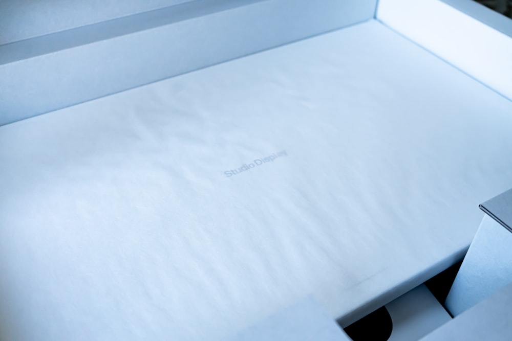 a close up of a white box with a white sheet