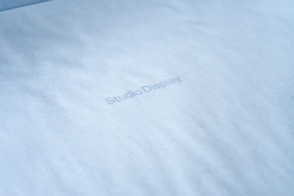 a close up of a white sheet with the word studio displayed on it