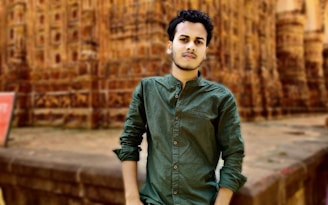A young professional from Sri Lanka standing confidently in front of the iconic Colosseum in Rome.