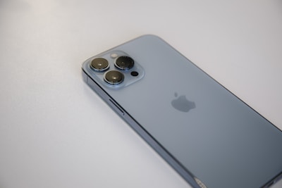 Oppo phone standing upright with a reflective back surface.