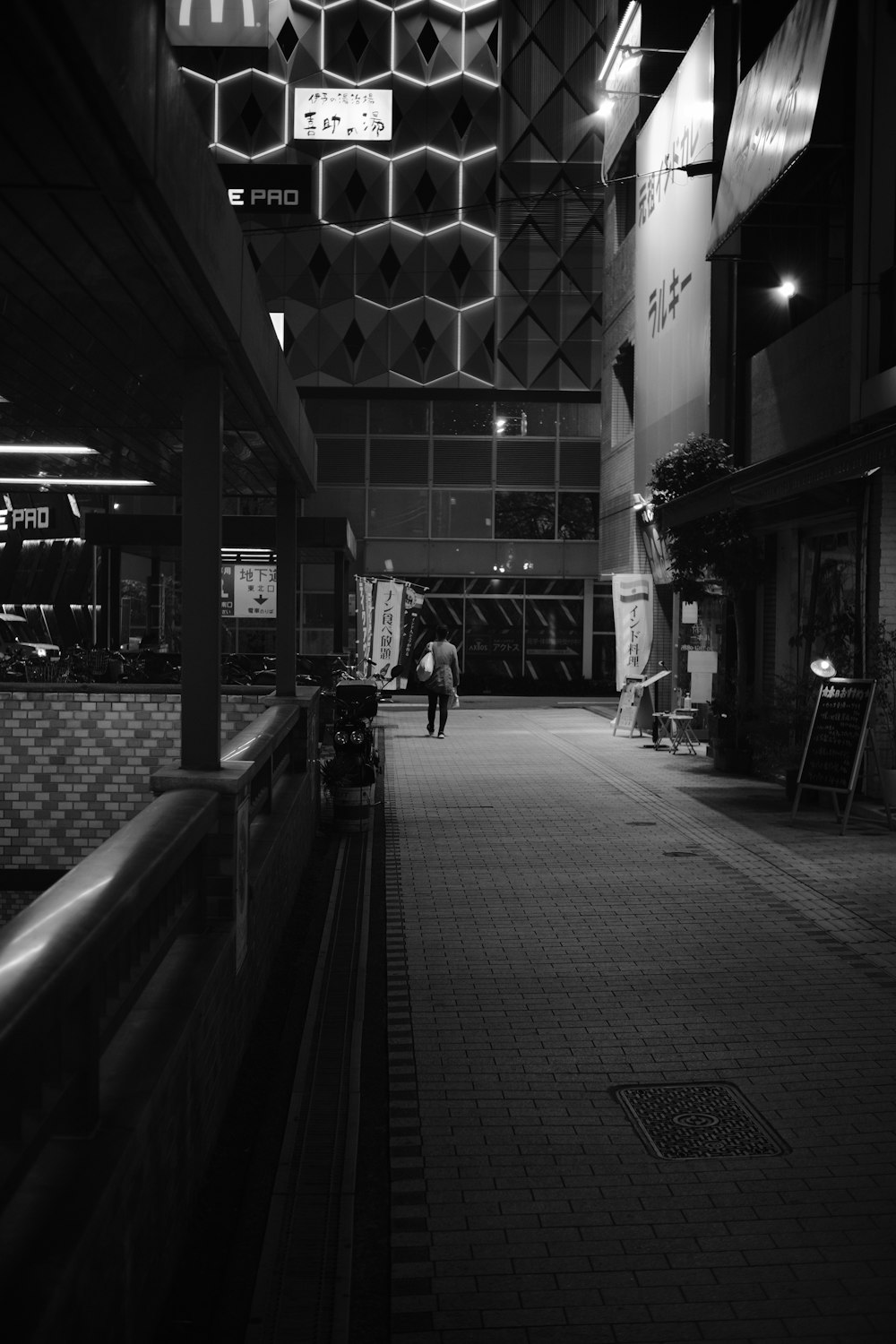 a black and white photo of a subway station