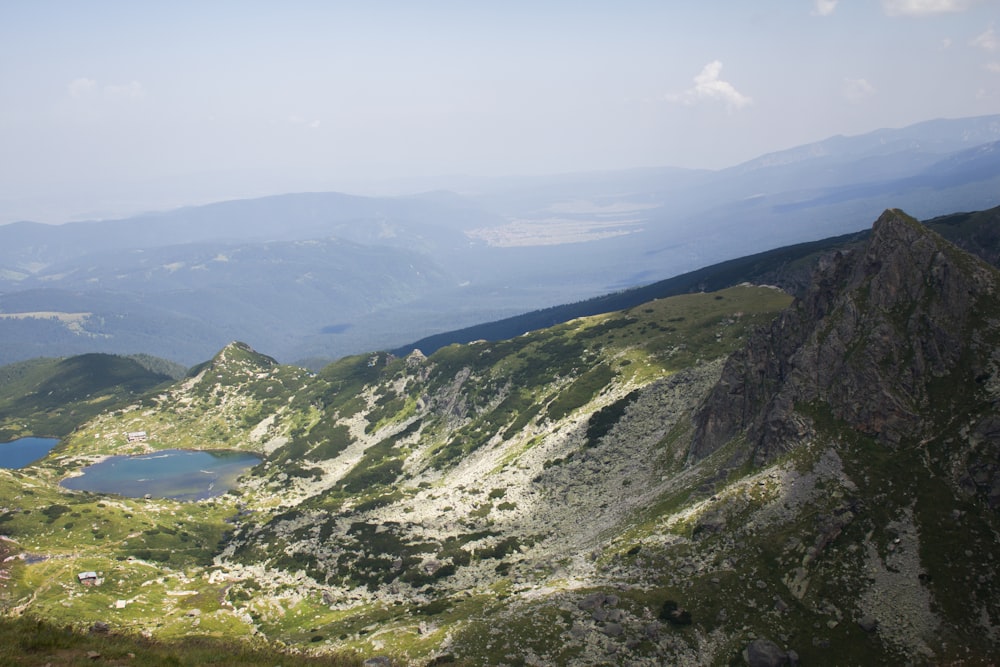 a view of a mountain range with a lake in the middle