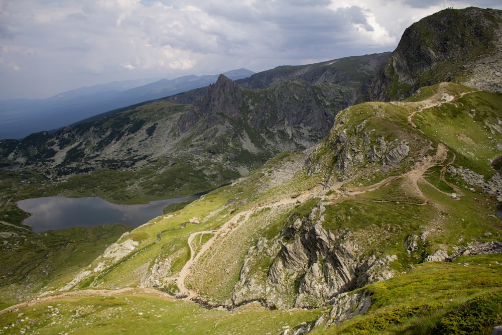 a view from the top of a mountain looking down at a winding road