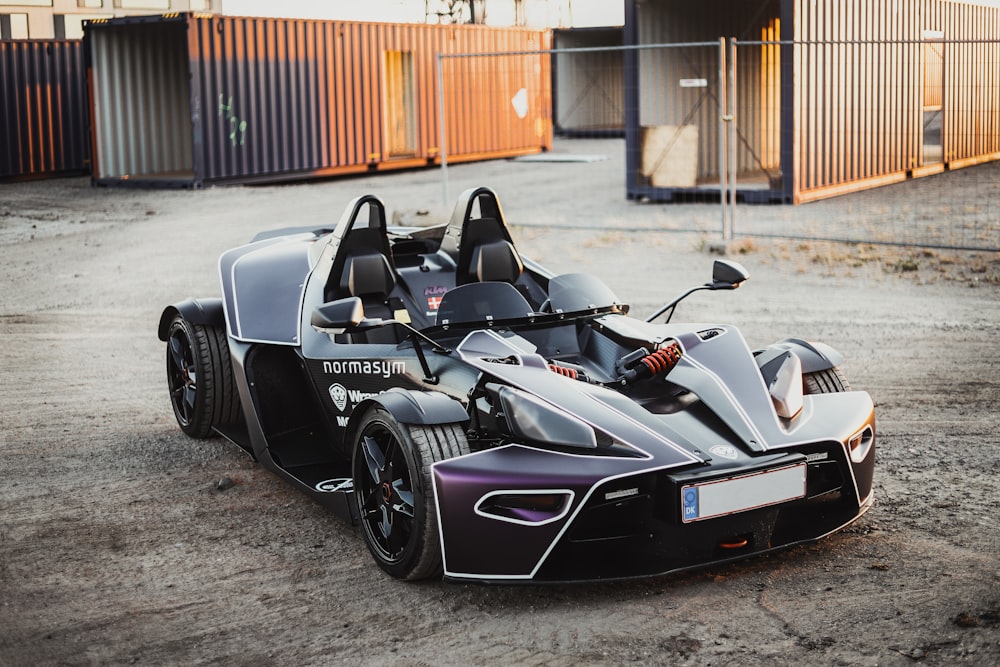 a black and silver car parked in a parking lot