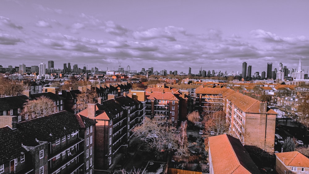 an aerial view of a city with tall buildings