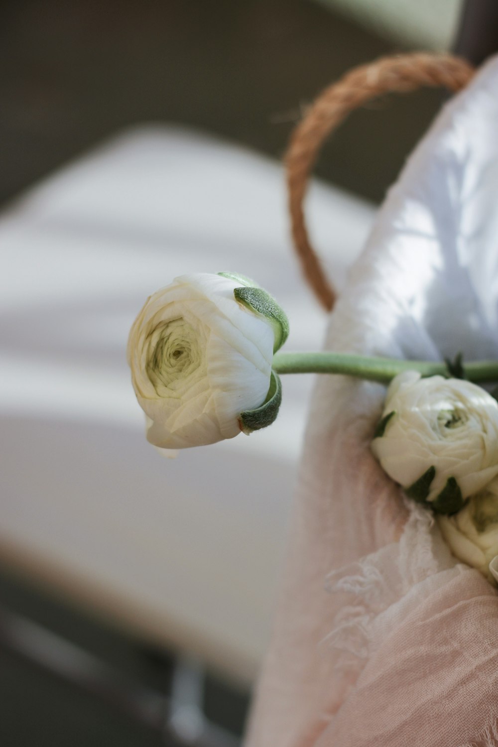 a bouquet of white flowers sitting on top of a chair