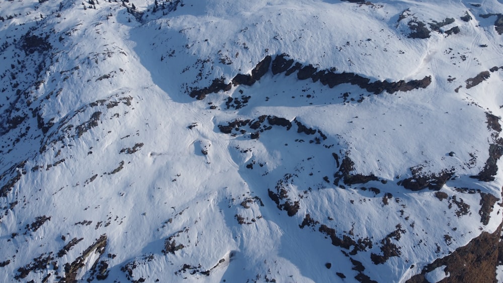 an aerial view of a snow covered mountain