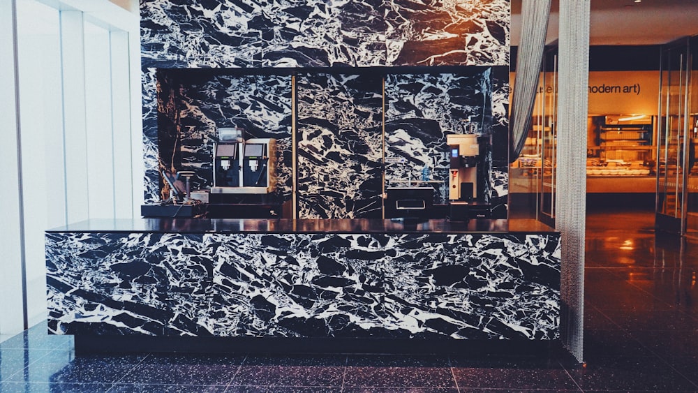 a black and white marble counter in a room