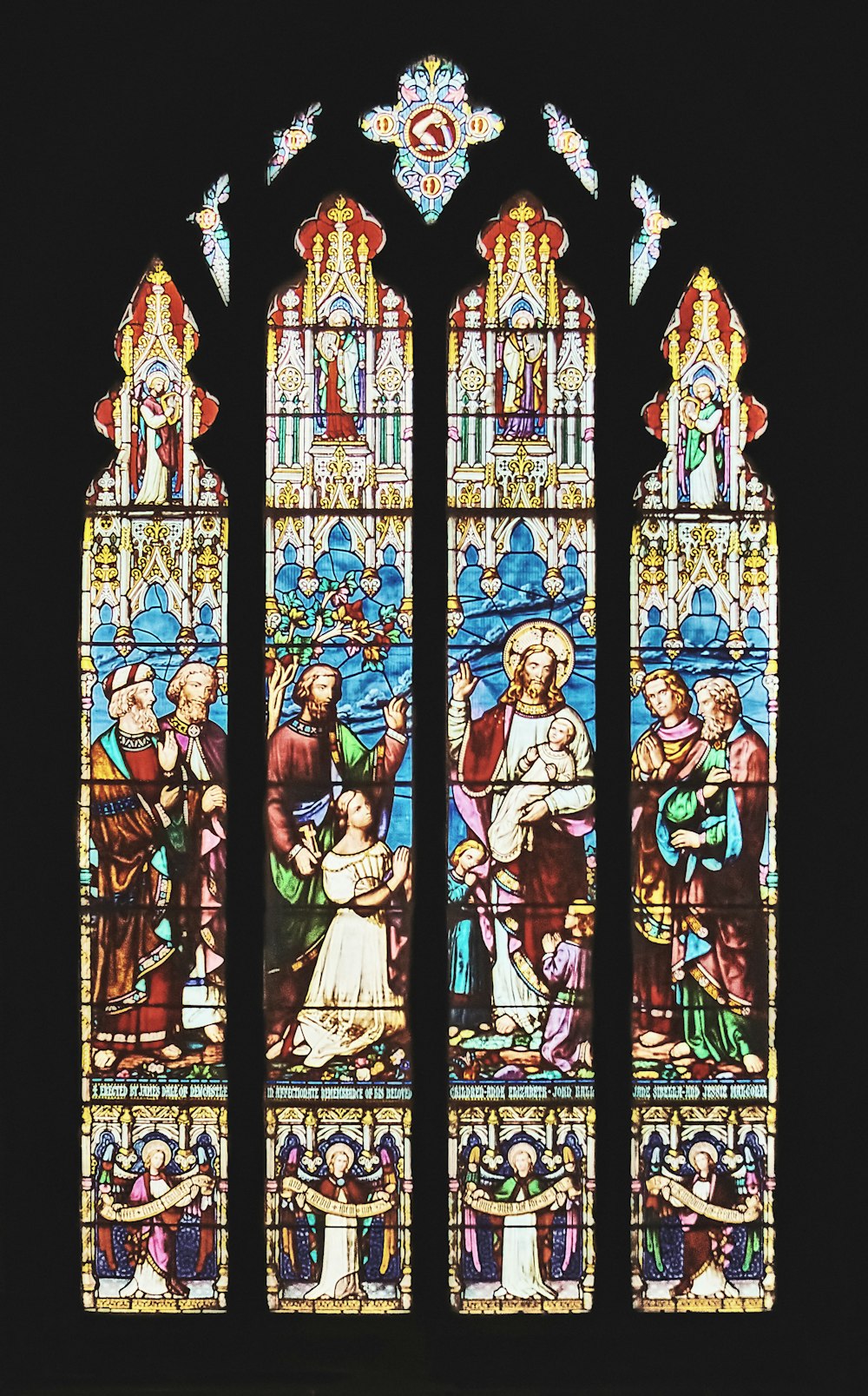 a stained glass window depicting the birth of jesus