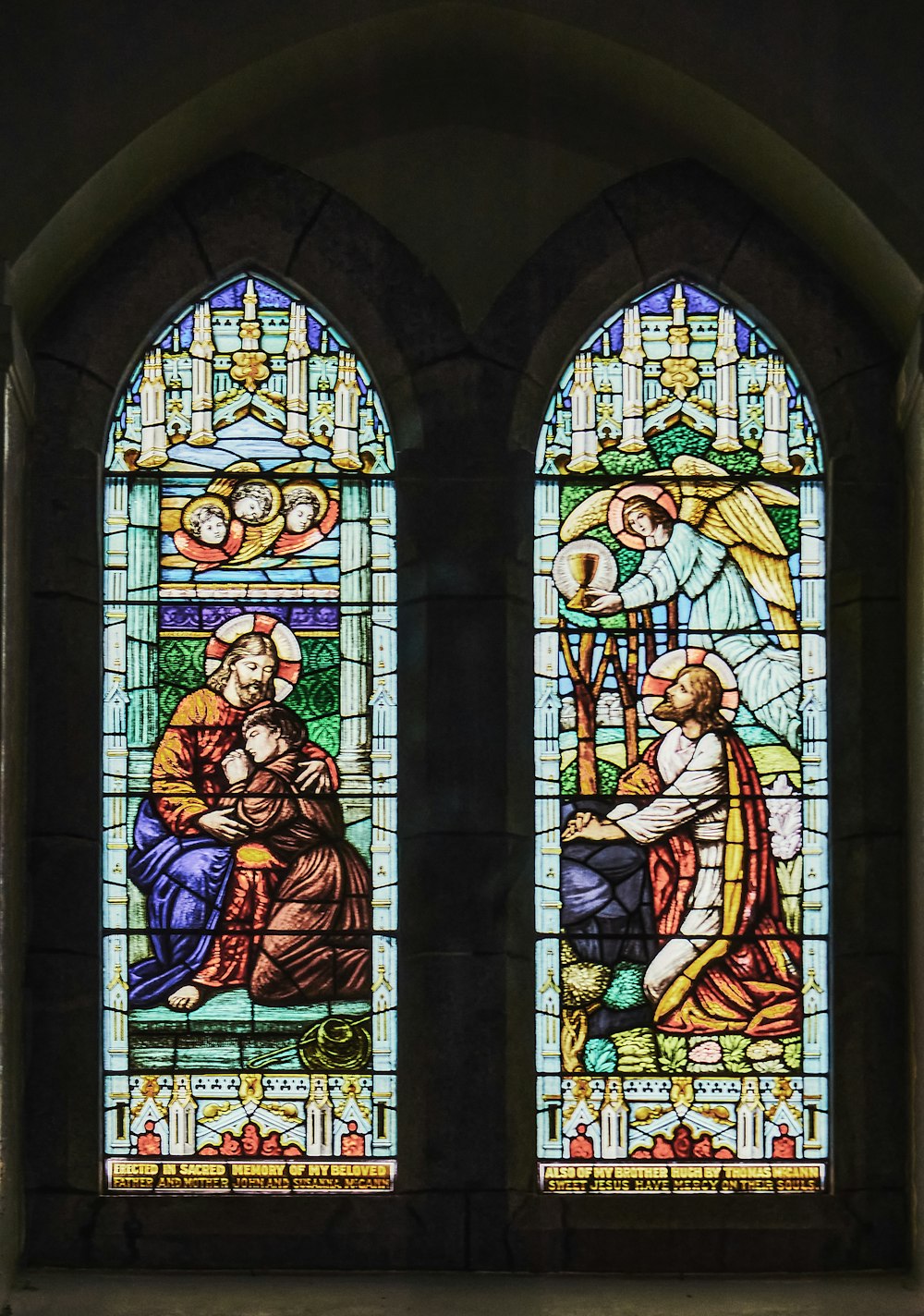 a stained glass window depicting the birth of jesus