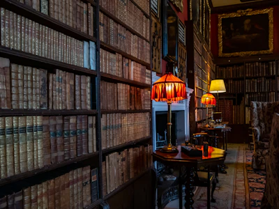 A warm gathering of diverse people sharing stories in a cozy library filled with books and art.