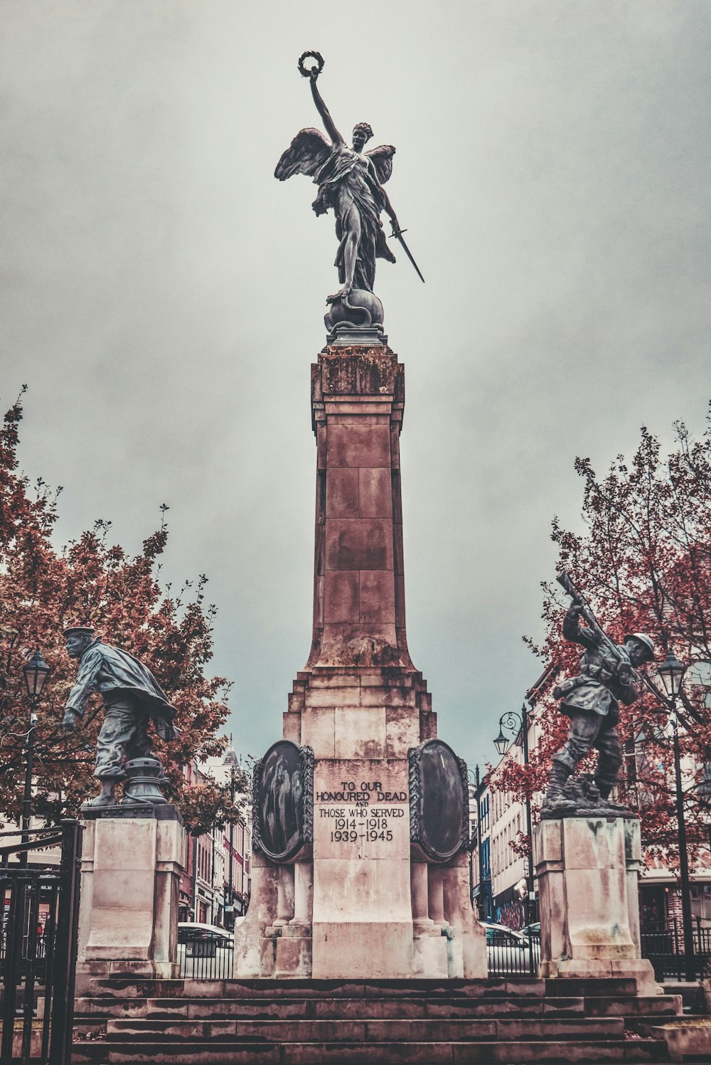 a statue of an angel on top of a monument