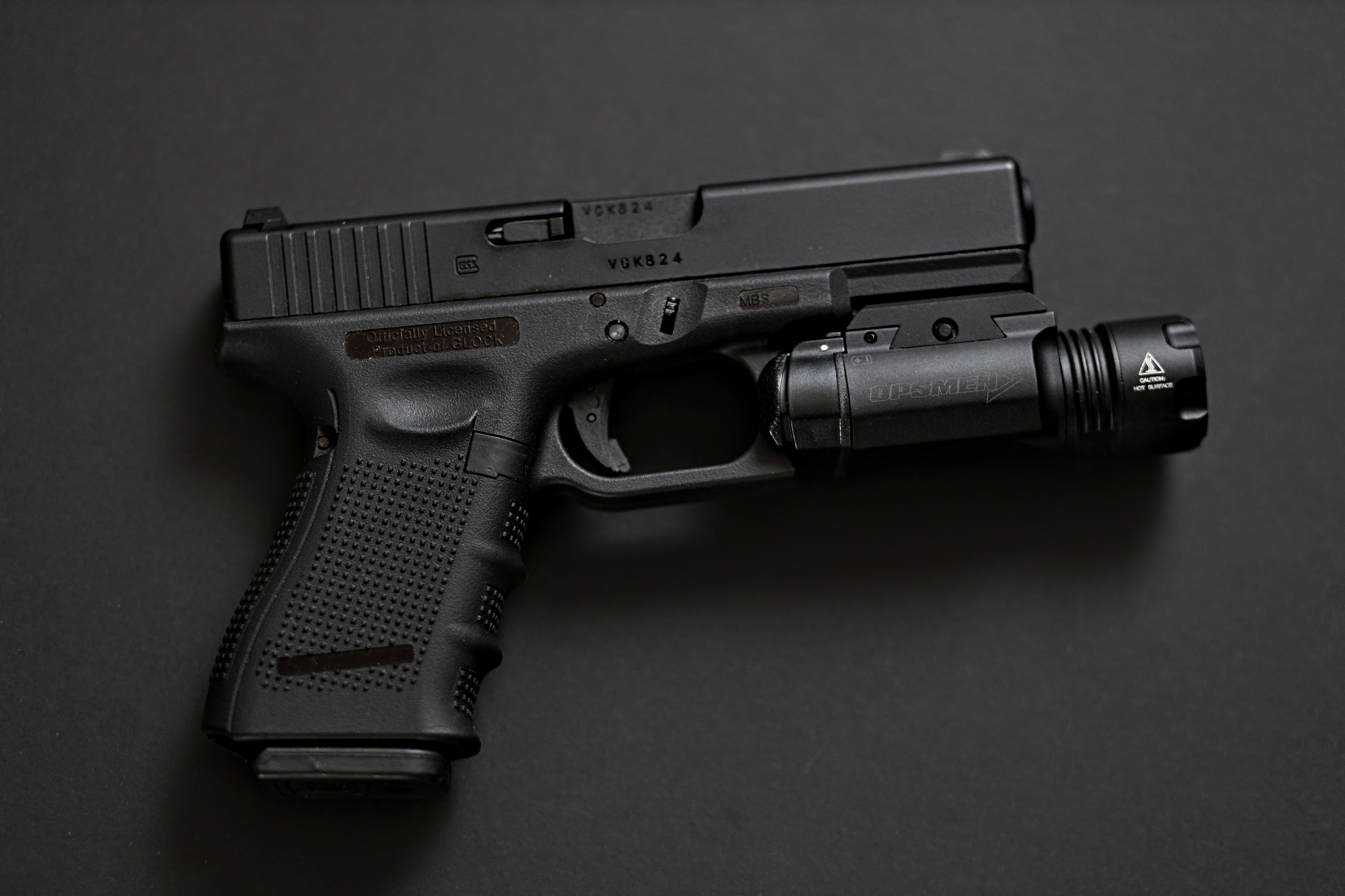 a close up of a gun on a table