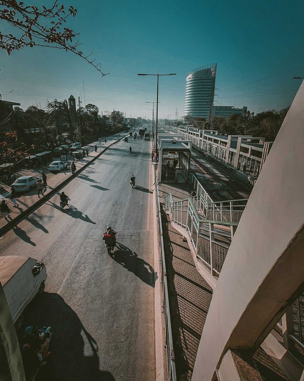 a person riding a motorcycle down a street