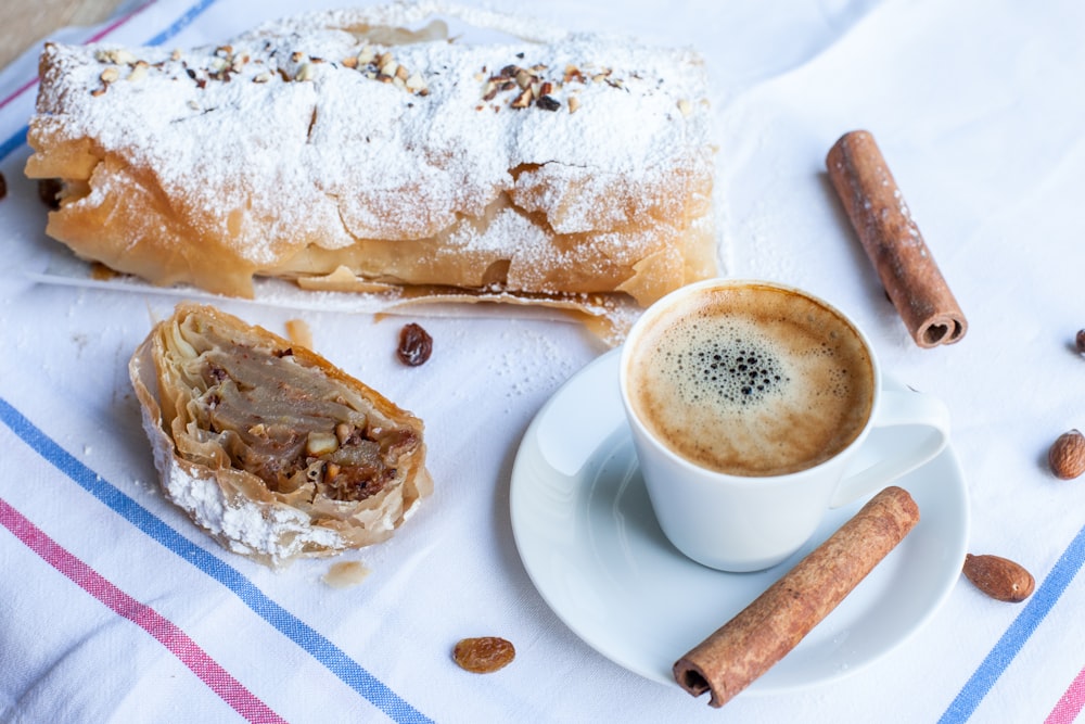 a pastry and a cup of coffee on a table
