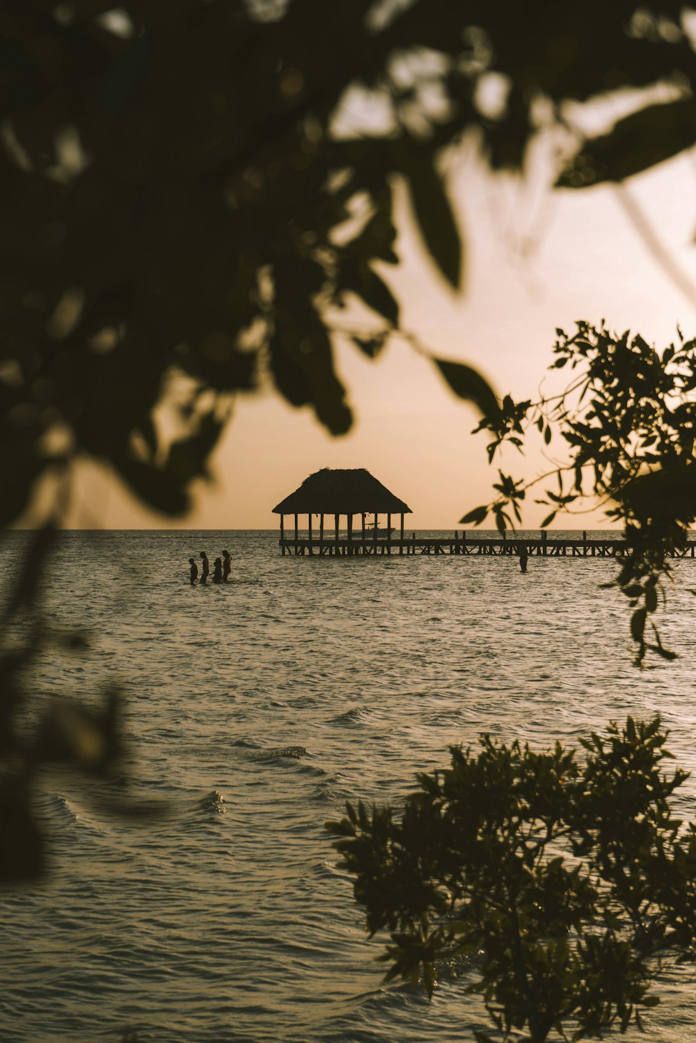 a body of water with a pier in the distance