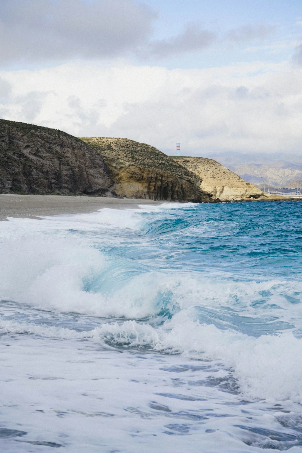 a person riding a surfboard on a wave in the ocean