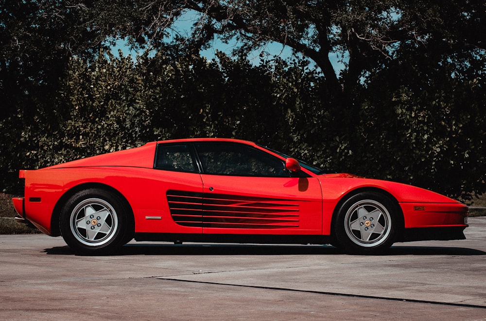 a red sports car parked in a parking lot