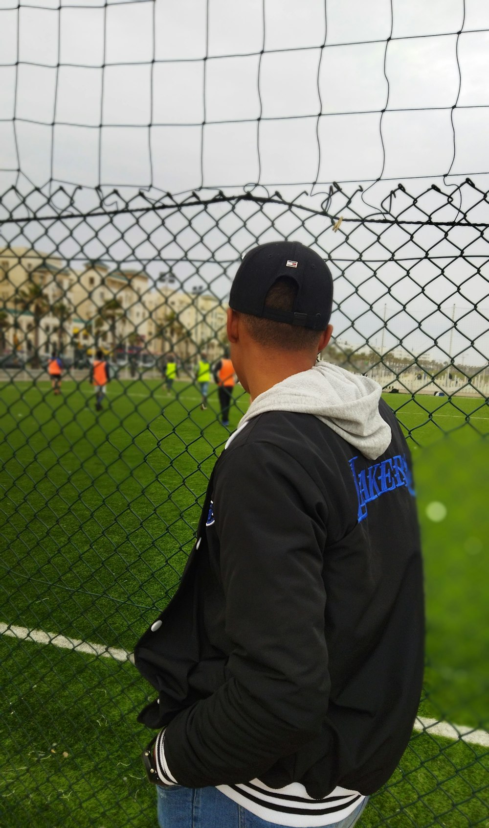 a man standing in front of a soccer goal