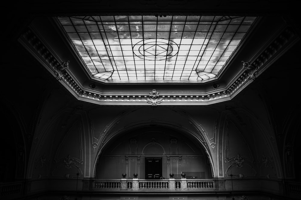 a black and white photo of a building with a skylight