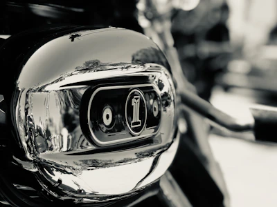 A close-up of hands carefully polishing a gold-accented surface, reflecting the brand colors.