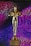 A golden statuette stands prominently on a base with an inscription that reads 'Do Whatever It Takes.' In the background, vibrant patterns of purple and blue lines create a dynamic and colorful backdrop.