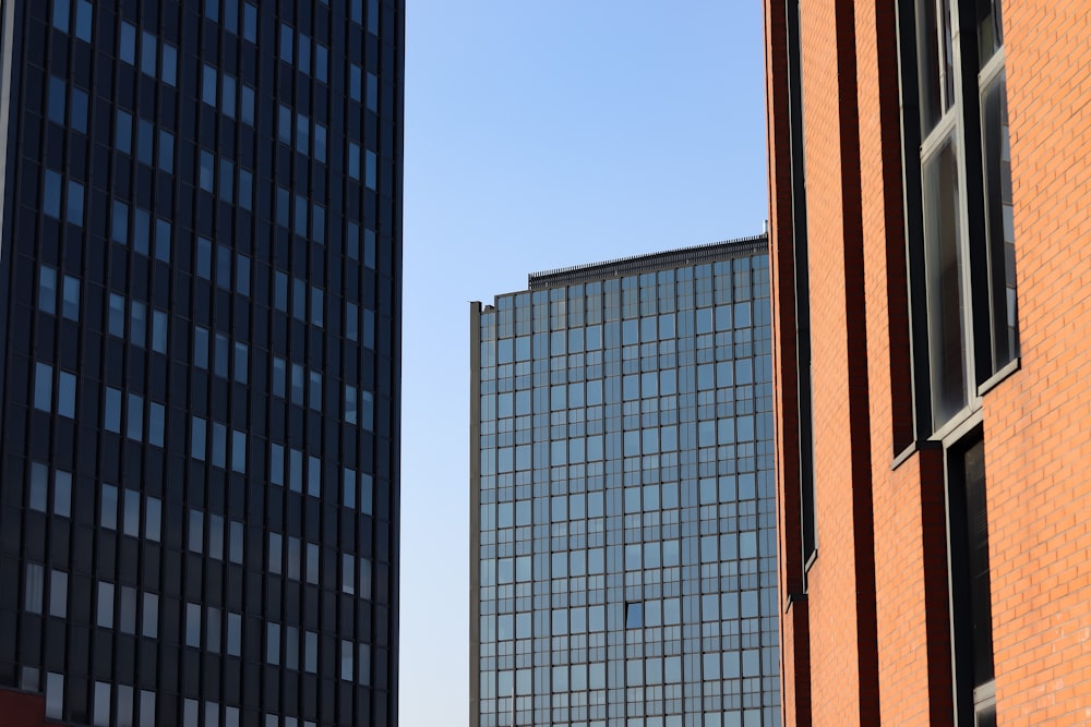 a couple of tall buildings next to each other