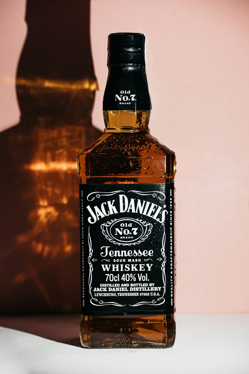 a bottle of jack daniels whiskey sitting on a table