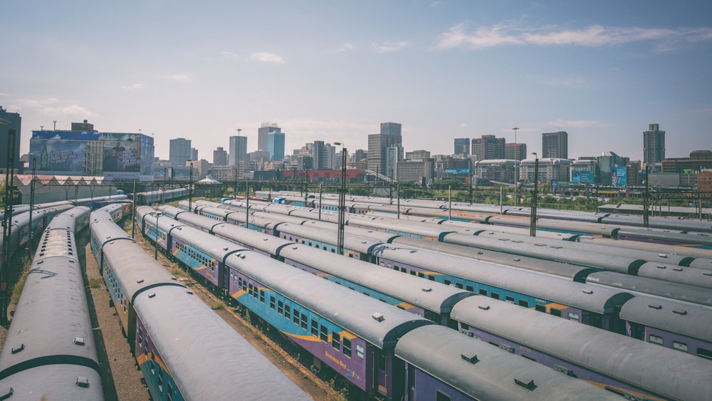 many trains are parked in a train yard