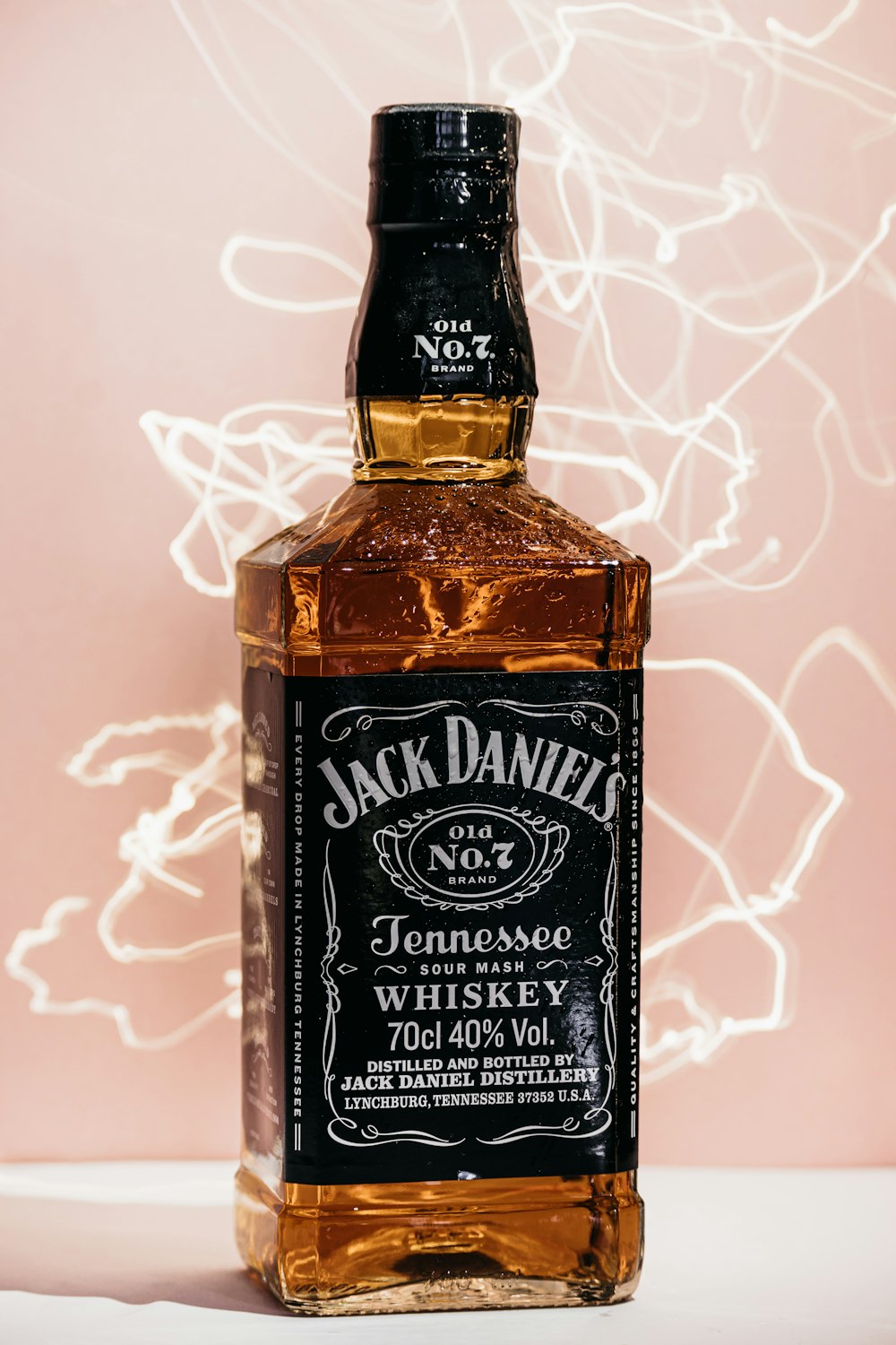 a bottle of jack daniels whiskey sitting on a table