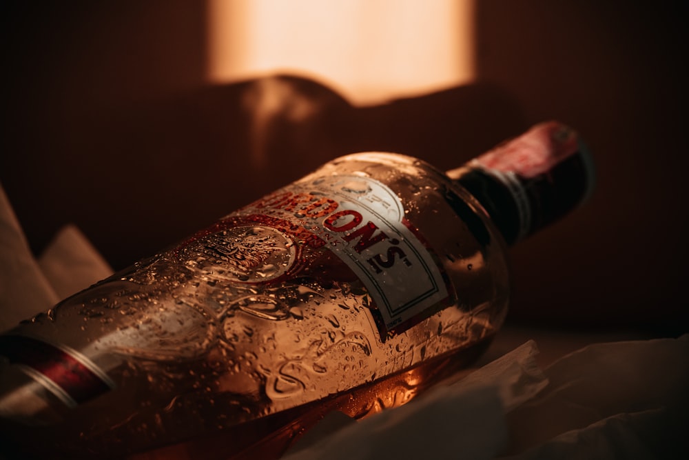 a close up of a bottle of alcohol on a table