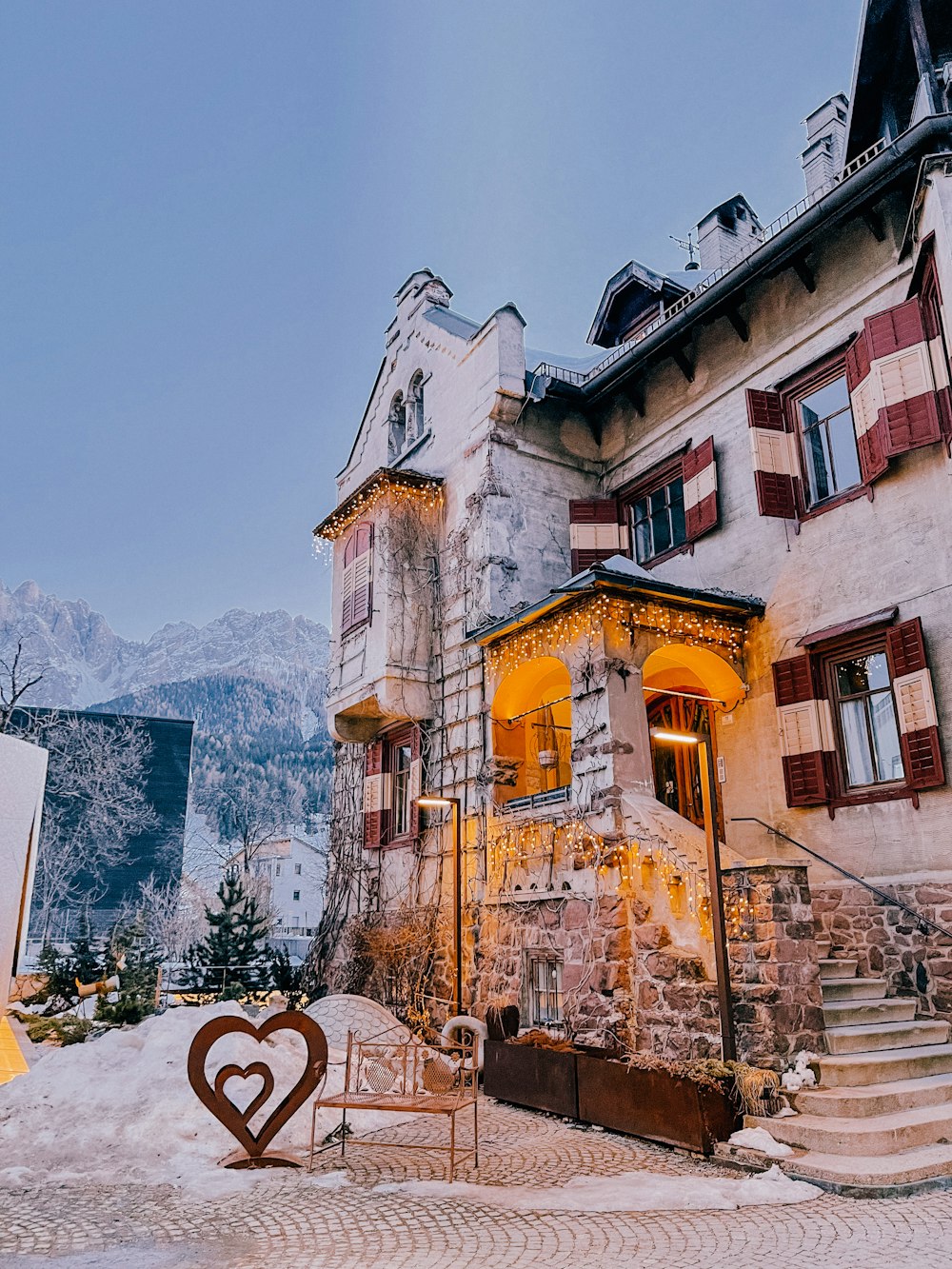 a building with a heart shaped sign in front of it